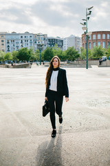 Confident businesswoman in the street