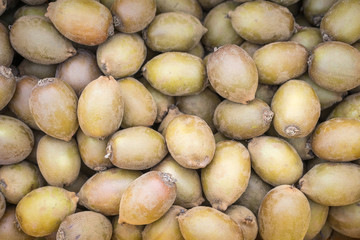 Top view of golden kiwifuit in a basket.
