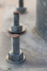 Close up on the bolts and nuts on the industrial equipment