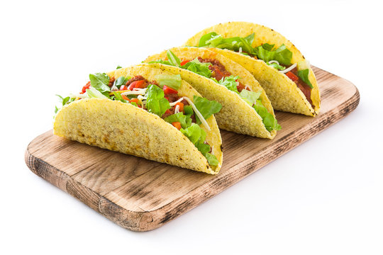Traditional Mexican tacos with meat and vegetables, isolated on white background

