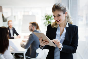 Elegant smart businesswoman in company office