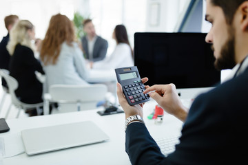 Accountant checking statistics of company