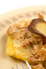 Closeup macro of served fresh mousaka on the plate