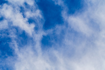 white fluffy clouds in the blue sky