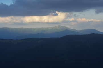 Obraz premium Evening landscape with a mountain peak