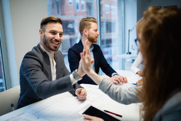 Delighted business people celebrating successful year