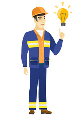 Builder pointing at bright idea light bulb.