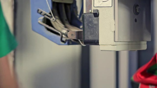 Packing for animal feed in bags man at the factory for the production of animal feed