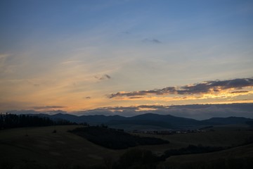 Sunset and sunrise with dramatic colorful clouds. Slovakia