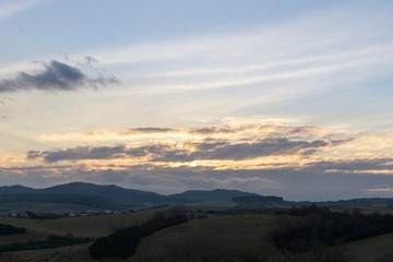Sunset and sunrise with dramatic colorful clouds. Slovakia
