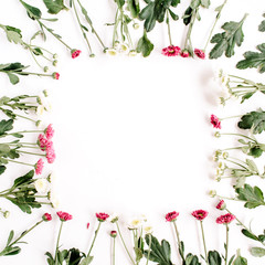Wreath frame of red and white wildflowers, green leaves, branches on white background. Flat lay, top view. Valentine's background