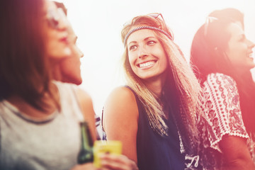 Happy friends outdoors having fun in summer