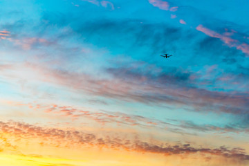 Fototapeta na wymiar Airplane at sunset