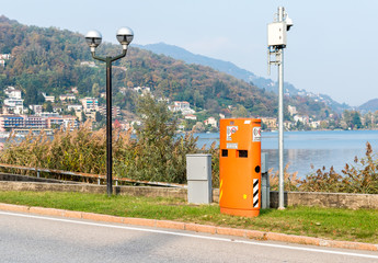 Pavement mounted Speed control device hidden inside the orange box, situated in urban areas of...