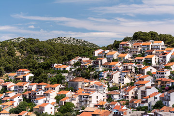 Fototapeta na wymiar Red roofs of Sibenik, an old town on Adriatic coast in Dalmatia, Croatia