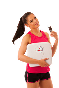 fit woman with scale and protein bar isolated over white background