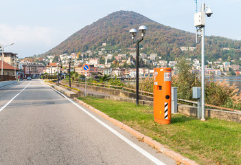Pavement mounted Speed control device hidden inside the orange box, situated in urban areas of...