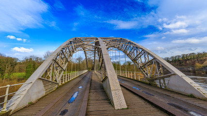 Old Wylam railway bridge crossing the river Tyne in Northumberland, England