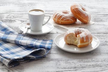 Coffee with Donuts on white table
