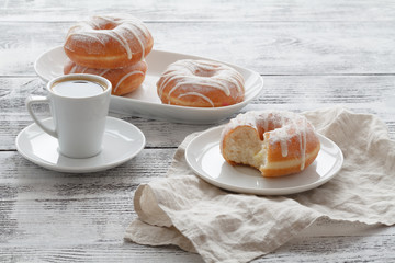 Coffee with Donuts on white table