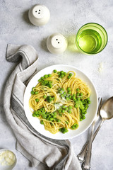 Obraz na płótnie Canvas Spring spaghetty with broccoli and green pea.Top view.