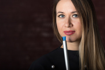 Obraz premium Young, beautiful girl smokes a hookah