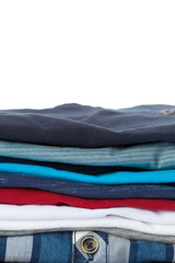 Stack of clothes on white background, closeup