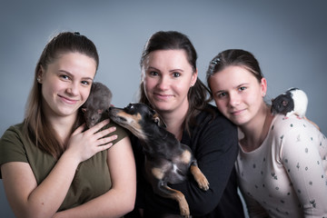 Happy family with home animals