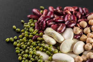 mix of beans on wooden table