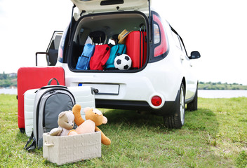 Car trunk with luggage. Travel concept