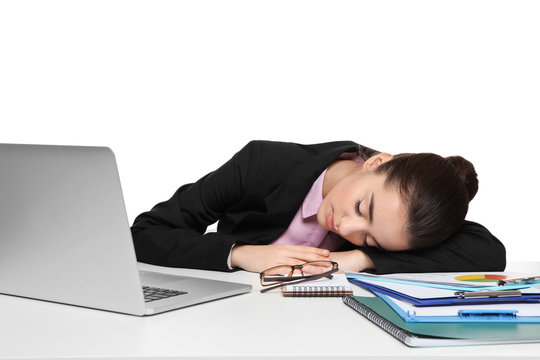 Young woman tired of working with laptop, on white background