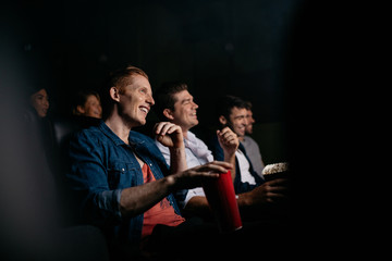 Group of people watching movie in theater - obrazy, fototapety, plakaty