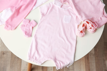 Set of baby clothes on light table