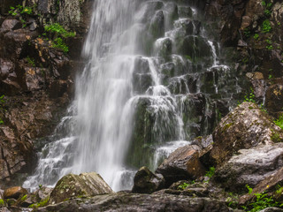 Big waterfall in green stone
