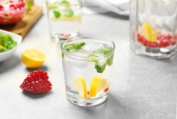 Glass of cold fruit cocktail on table