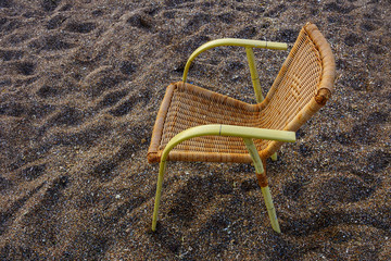 Fototapeta na wymiar Bamboo chair on the beach