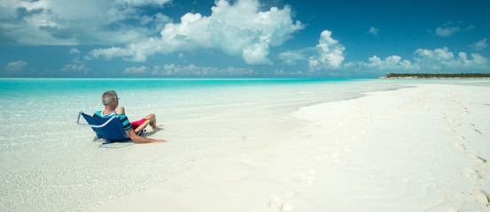 Obraz na płótnie Canvas Man at Sandy Cay, Bahamas
