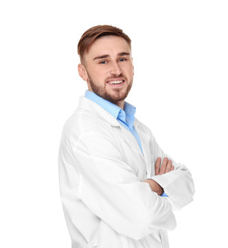 Handsome doctor with crossed hands on white background