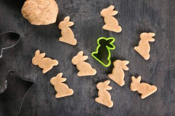 Raw rabbit shape Easter cookies on table