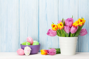 Fototapeta premium Easter eggs and colorful tulips bouquet