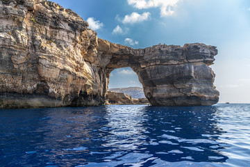 The island of Gozo, Malta. View of the Azure Window (UNESCO World Heritage List) from the sea - obrazy, fototapety, plakaty