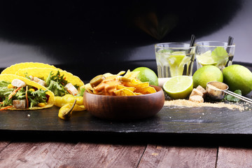 Caipirinha of Brazil, tacos and delicious nachos with melted cheese