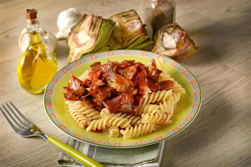 Fototapeta premium pasta with tomato sauce and artichokes