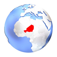 Niger on metallic globe isolated