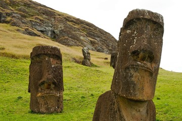 Long shot of Moai statues at the famous Moai statue quarry around the Rano Raraku volcano in Easter...