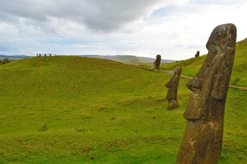 Long shot of Moai statues at the famous Moai statue quarry around the Rano Raraku volcano in Easter...