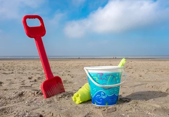 Foto auf Acrylglas Children's bucket and spade on the beach of De Haan, Belgium. © Erik_AJV
