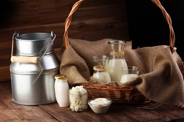 milk products - tasty healthy dairy products on a table on: sour cream in a white bowl, cottage...