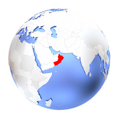 Naklejka premium Oman on metallic globe isolated