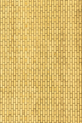 A yellow wall made of brick for background and texture.